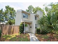 Charming two-story home with a light exterior, well-maintained landscaping, and a welcoming front entrance at 623 Bay Tree Ct, Mount Pleasant, SC 29464