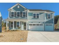 Charming two-story home featuring a covered porch and a spacious three-car garage at 2027 Riverbend Dr, James Island, SC 29412