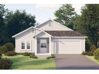 Charming single-story home featuring a two-car garage, white siding, a well-manicured lawn, and mature trees at Blvd, Moncks Corner, SC 29461