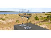 Enjoy stunning views from the balcony, perfect for relaxing with a glass of wine in this coastal home at 1334 Pelican Watch Villas, Seabrook Island, SC 29455