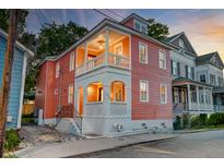 Charming two-story home with a covered porch and classic architectural details at 15 Dewey St, Charleston, SC 29403