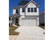 Charming two-story home with white siding, a covered porch, and a spacious two-car garage at 1716 Grovehurst Dr, Charleston, SC 29414