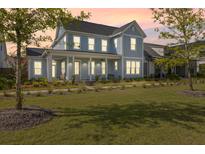 Charming two-story home featuring a welcoming front porch and manicured lawn at 113 Jackson Pond Ct, Summerville, SC 29486