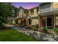 Charming townhomes with brick and siding facades, complemented by well-maintained lawns and landscaping at 125 Macy Cir, Goose Creek, SC 29445