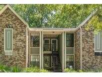 Brick exterior with inviting front entrance and stairs leading to the second level condos at 1872 Montclair Dr # C, Mount Pleasant, SC 29464