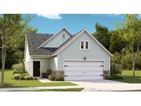 Charming one-story home featuring a welcoming facade, attached garage, and well-manicured landscaping at 1009 Sagegrass St, Summerville, SC 29485