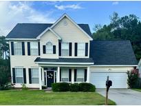 Charming two-story home with a well-manicured lawn and black shutters, offering classic curb appeal at 620 Saint Ives Ln, Goose Creek, SC 29445