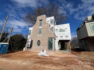 Brick front exterior of a new construction home at 715 Charles Ave, Charlotte, NC 28205