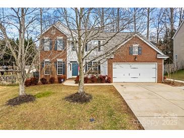 Two-story brick home with attached garage and landscaping at 286 Glencoe Ln, Mooresville, NC 28117