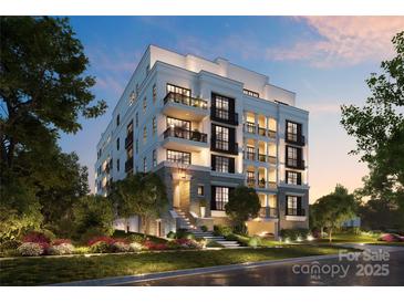 Luxury 3-story building with classic architecture, multiple balconies, and landscaped grounds at 409 Queens Rd # 203, Charlotte, NC 28207