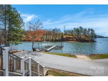 Scenic lakefront property featuring a private dock, perfect for boating and enjoying waterfront living at 121 Pebble Creek Dr, Stony Point, NC 28678