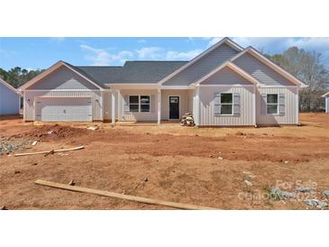 Charming home with white siding, gray shutters, and a covered front porch at 6154 Lowder Rd, Salisbury, NC 28147