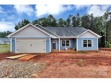 Charming blue single-story home with attached garage and craftsman-style details at 6133 Long Branch Rd, Salisbury, NC 28147