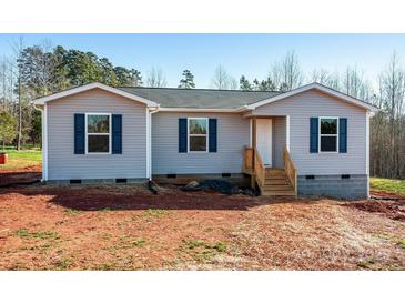 Newly constructed single-story home with gray siding and blue shutters at 7741 Marlette Ln, Sherrills Ford, NC 28673