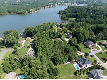 Aerial view showcasing waterfront homes nestled along the tree-lined shores of Lake Norman at 127 Palos Verde Rd, Mooresville, NC 28117