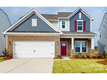 Two-story house with gray and beige siding, red door, and a two-car garage at 2070 Van Buren Rd, Sherrills Ford, NC 28673