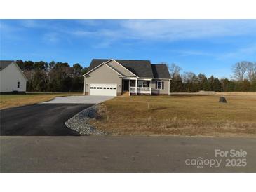 Newly constructed home with gray siding, white garage door, and front porch at 126 Mason Tanner Ct # 6, Rock Hill, SC 29730