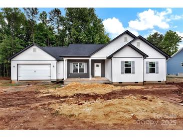 Charming single-story home with white siding, a gray roof, and an attached garage at 6169 Long Branch Rd, Salisbury, NC 28147