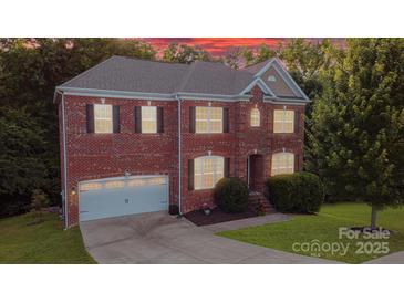 Brick two-story home with a two-car garage and landscaped yard at 5267 Norway Ln, Rock Hill, SC 29732