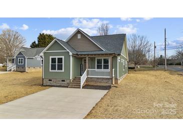 Charming craftsman style home with a welcoming front porch and landscaped yard at 528 Moss Springs Rd, Albemarle, NC 28001