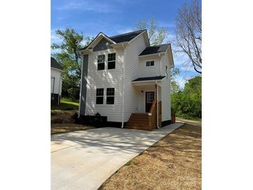 Charming two-story home with a well-manicured lawn and inviting entrance at 1137 6Th St, Lancaster, SC 29720