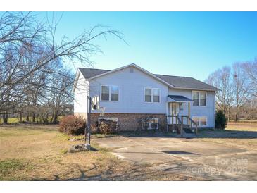 Charming two-story home with a well-maintained lawn, spacious driveway, and a basketball hoop for outdoor fun at 2725 Carla Dr, Shelby, NC 28150