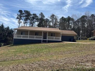 Charming single-story home featuring a welcoming front porch and well-maintained lawn at 2290 9Th Avenue Ne Dr, Hickory, NC 28601