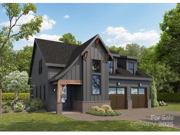 Stunning modern farmhouse with a two-car garage and beautifully landscaped front yard at 2625 Ritz Ln, Matthews, NC 28105