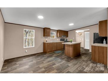 Spacious kitchen with island and modern appliances at 850 Mereva Rd, Smyrna, SC 29743