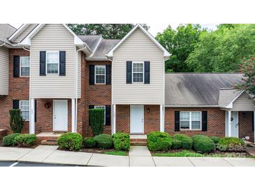 Charming townhome with brick and siding exterior, black shutters, and well-maintained landscaping at 2222 15Th Ne Ave # 505, Hickory, NC 28601