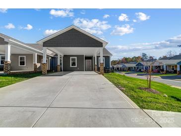 Gray exterior with carport and landscaped lawn at 1529 28Th Street Se Pl, Hickory, NC 28602