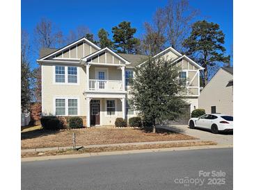 Charming two-story home with a covered front porch and well-maintained landscaping at 11521 Allen A Brown Rd, Charlotte, NC 28269