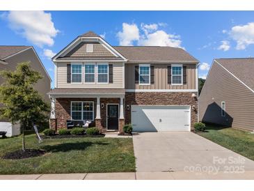 Two-story house with stone accents and a two-car garage at 181 Atwater Landing Dr, Mooresville, NC 28117