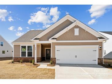 Charming single-Gathering home featuring a neutral color palette and a two-car garage at 888 Exeter Dr, Sherrills Ford, NC 28673