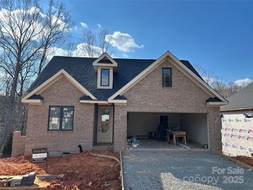 Brick house with a two-car garage and landscaping at 94 Sterling Branch Loop # 94, Denver, NC 28037