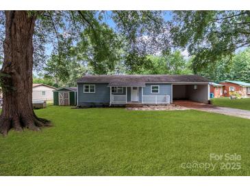 Newly renovated blue house with carport and storage shed at 4972 Mayble St, Catawba, NC 28609