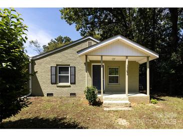 Charming ranch home with a covered porch and landscaped yard at 1762 Old Carter St, Lancaster, SC 29720