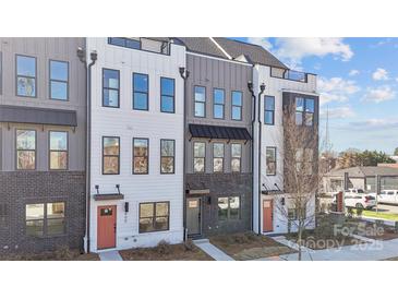 New townhouse with brick and siding details and colorful doors, creating curb appeal at 459 Blairhill Rd # 02, Charlotte, NC 28217