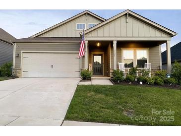 Beautiful two-story home with a welcoming front porch and landscaped lawn at 3524 Tully Ave, Kannapolis, NC 28081