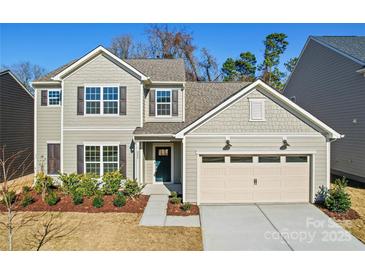 Charming two-story home with a two-car garage and manicured landscaping at 225 English Arbor Dr # 13, Fort Mill, SC 29715