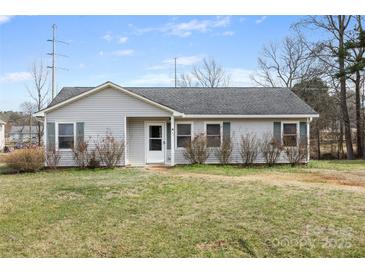 Charming single-story home with light gray siding, green shutters, and a well-maintained front lawn at 101 Turner Dr, Clover, SC 29710