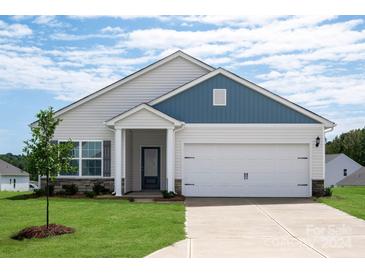 Charming single-story home featuring stone accents, a two-car garage, and a well-manicured front yard at 3607 Clover Valley Dr, Gastonia, NC 28052
