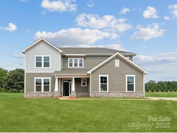 Two-story house with gray siding, stone accents, and a front porch at 1145 Coppergate Dr, Salisbury, NC 28147