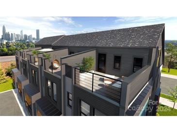 Spacious rooftop deck with city views and comfortable seating at 2208 N Graham St # 10, Charlotte, NC 28206