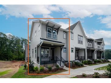 Two-story home with a welcoming porch and manicured landscaping at 441 Nathaniel Way # Brx0035, Charlotte, NC 28213