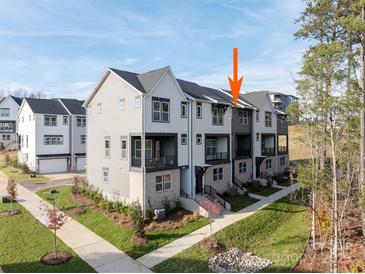 Modern townhome with neutral siding, brick accents, and a well-maintained lawn and landscape at 432 Nathaniel Way # Brx0043, Charlotte, NC 28213