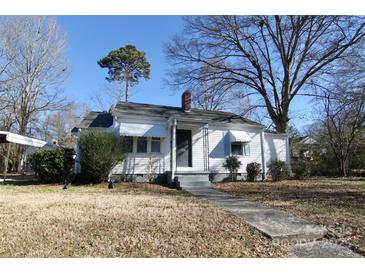 White house with gray steps, awnings, and landscaping at 602 Glenn St, Gastonia, NC 28052