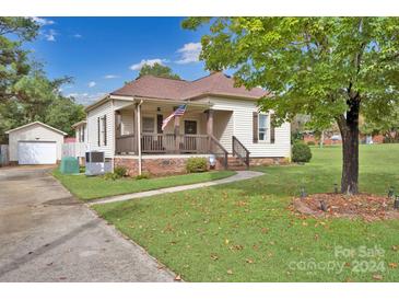 Charming one-story house with front porch and landscaped yard at 410 Gaddy St, Kannapolis, NC 28081