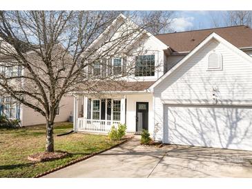 Charming two-story home with well-maintained lawn, landscaping, and a two-car garage at 4741 Nijinsky Ct, Charlotte, NC 28216