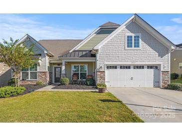 Charming single-Gathering home with a well-manicured lawn and two-car garage at 4023 Home Grown Way, Lake Wylie, SC 29710